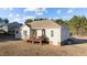 Tan house exterior with deck and backyard at 202 Meadow Loop Dr, Clayton, NC 27527