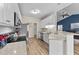 Modern kitchen with white cabinets, granite countertops, and stainless steel appliances at 202 Meadow Loop Dr, Clayton, NC 27527