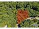 Aerial view showing a large wooded lot bordered by a road at 2100 Tadley Dr, Chapel Hill, NC 27514