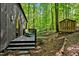 Home features a deck, shed, and wooded backyard at 2100 Tadley Dr, Chapel Hill, NC 27514