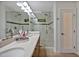 Elegant bathroom with double sinks, glass-enclosed shower, and modern design at 2100 Tadley Dr, Chapel Hill, NC 27514