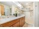 Modern bathroom with double vanity, glass shower, and updated fixtures at 2100 Tadley Dr, Chapel Hill, NC 27514