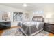 Cozy bedroom with wood floors, window seat, and natural light at 2100 Tadley Dr, Chapel Hill, NC 27514