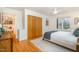 Charming bedroom with wood floors, built-in closet, and view of nature at 2100 Tadley Dr, Chapel Hill, NC 27514