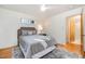 Well-lit bedroom with wood floors and access to a bathroom at 2100 Tadley Dr, Chapel Hill, NC 27514