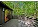 Large deck overlooking wooded area, perfect for outdoor entertaining at 2100 Tadley Dr, Chapel Hill, NC 27514