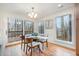 Bright dining room with hardwood floors and sliding glass doors leading to deck at 2100 Tadley Dr, Chapel Hill, NC 27514