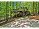 Modern home with elevated deck nestled in the woods at 2100 Tadley Dr, Chapel Hill, NC 27514