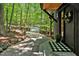 Stone walkway leading to the front door, surrounded by trees at 2100 Tadley Dr, Chapel Hill, NC 27514