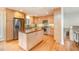 Spacious kitchen with wood cabinets, stainless steel appliances and breakfast bar at 2100 Tadley Dr, Chapel Hill, NC 27514