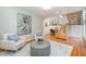 Cozy sitting area with hardwood floors and a modern staircase at 2100 Tadley Dr, Chapel Hill, NC 27514