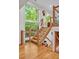 Open staircase with glass railings and hardwood treads at 2100 Tadley Dr, Chapel Hill, NC 27514