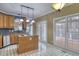 Kitchen with island, granite countertops, and wood cabinets at 212 Red Field St, Cary, NC 27513