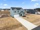Two-story house, gray siding, driveway, and backyard at 233 John Stark Dr, Fuquay Varina, NC 27526