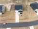 Aerial view of a two-story house with a gray roof and attached garage at 233 John Stark Dr, Fuquay Varina, NC 27526