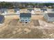 Aerial view of a neighborhood with several houses at 233 John Stark Dr, Fuquay Varina, NC 27526
