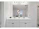 Clean bathroom with double vanity, quartz countertop, and white cabinets at 233 John Stark Dr, Fuquay Varina, NC 27526