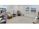 Cozy bedroom featuring a rocking chair, carpet flooring, and natural light at 233 John Stark Dr, Fuquay Varina, NC 27526