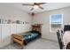 Cozy bedroom with a twin bed, window, and unique wall decor at 233 John Stark Dr, Fuquay Varina, NC 27526