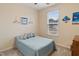 Serene bedroom with a full-size bed, window, and neutral decor at 233 John Stark Dr, Fuquay Varina, NC 27526