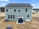 Two-story house, gray siding, patio furniture, and a grill at 233 John Stark Dr, Fuquay Varina, NC 27526