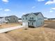 Two-story house exterior, gray siding, attached garage, and landscaping at 233 John Stark Dr, Fuquay Varina, NC 27526