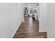 Bright hallway with hardwood floors leading to the living room at 233 John Stark Dr, Fuquay Varina, NC 27526
