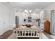 Eat-in kitchen with white cabinets, granite counters, and a center island at 233 John Stark Dr, Fuquay Varina, NC 27526