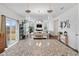 Open concept kitchen with island, granite counters and view into the living room at 233 John Stark Dr, Fuquay Varina, NC 27526