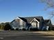 Gray siding ranch home with white trim and a grassy yard at 2690 Polenta Rd, Clayton, NC 27520