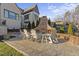 Brick fireplace and patio with white rocking chairs at 3018 Farrior Rd, Raleigh, NC 27607