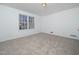 Spacious bedroom with carpeted floor and large window at 313 S Main Street St, Wake Forest, NC 27587