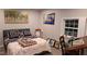 Comfortable bedroom featuring a decorative quilt, bedside table, and serene artwork at 3259 Us 421, Lillington, NC 27546