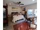 Inviting bedroom with stylish decor, a cozy quilt, and a workspace by the window at 3259 Us 421, Lillington, NC 27546