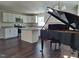 Modern kitchen with white cabinets, granite countertops, and stainless steel appliances, piano at 3259 Us 421, Lillington, NC 27546