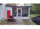 Enclosed porch showcasing outdoor seating, offering a cozy and private space for relaxation and leisure at 3259 Us 421, Lillington, NC 27546