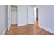 Bright bedroom with hardwood floors and closet at 329 Clark St, Durham, NC 27701