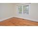 Bright bedroom with hardwood floors and large window at 329 Clark St, Durham, NC 27701