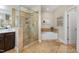 Elegant bathroom with soaking tub, glass shower, and heated towel rack at 332 Karpen Ln, Cary, NC 27519