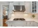 Stylish kitchen boasting stainless steel range hood and marble countertops at 332 Karpen Ln, Cary, NC 27519