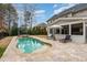 Relaxing backyard oasis with pool, hot tub, and patio furniture at 332 Karpen Ln, Cary, NC 27519