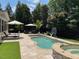 Inviting kidney-shaped pool with spa and patio area at 332 Karpen Ln, Cary, NC 27519