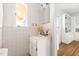 Simple bathroom with pedestal sink and built-in shelving at 3726 Randolph Rd, Durham, NC 27705