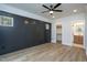 Bright bedroom with dark stained wall paneling and wood-look flooring at 4120 Emily Ln, Oxford, NC 27565