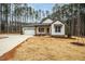 Newly built home with white siding, gray accents, and a two-car garage at 4120 Emily Ln, Oxford, NC 27565