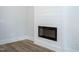 Modern electric fireplace with white shiplap wall at 4120 Emily Ln, Oxford, NC 27565