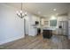 Modern kitchen with white cabinets, quartz island, and stainless steel appliances at 4120 Emily Ln, Oxford, NC 27565