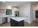 Modern kitchen with a large island, white cabinets, and stainless steel appliances at 4120 Emily Ln, Oxford, NC 27565