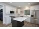 Open kitchen with white shaker cabinets, marble countertops, and stainless steel appliances at 4120 Emily Ln, Oxford, NC 27565