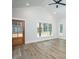 Spacious living room with hardwood floors, high ceilings, and large windows at 4120 Emily Ln, Oxford, NC 27565